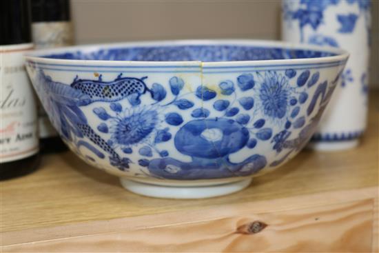 Two Chinese blue and white bowls and a famille rose bowl, 18th/19th century (3) Diameter 23cm